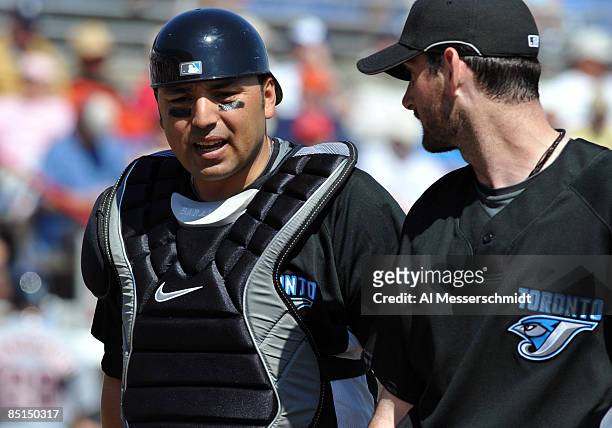 Catcher Rod Barajas and pitcher Matt Clement of the Toronto Blue Jays leave the pitching mound against the Detroit Tigers February 27, 2009 at...