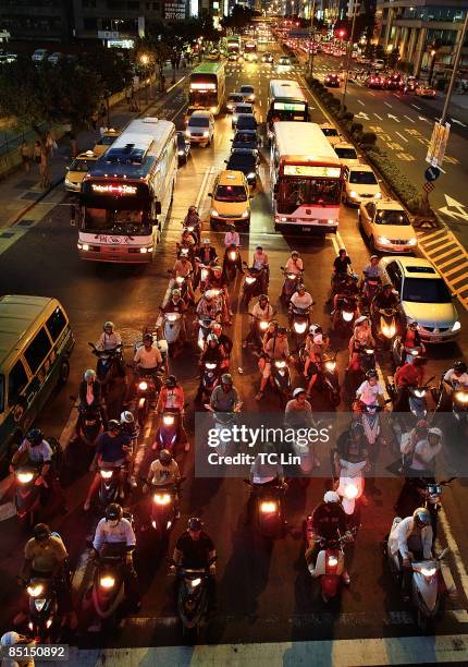 scooters at night - chengde stock pictures, royalty-free photos & images