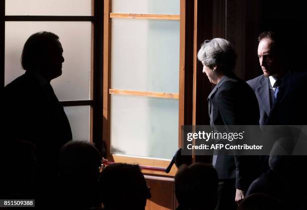 British Prime Minister Theresa May leaves after delivering speech aimed at unlocking Brexit talks, speaks on September 22 in Florence. May seeked to...