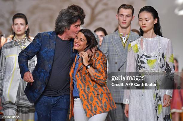 Designers Kean Etro gives a kiss to his sister designer Veronica Etro greet the audience at the end of their show Etro during the Women's...