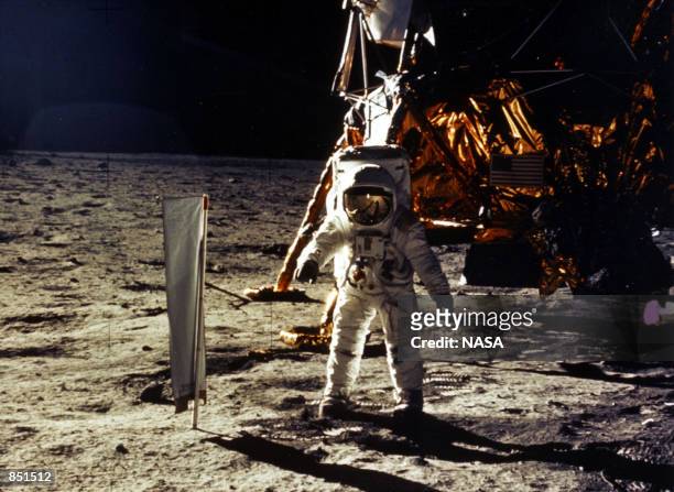 The deployment of scientific experiments by Astronaut Edwin Aldrin Jr. Is photographed by Astronaut Neil Armstrong. Man's first landing on the Moon...