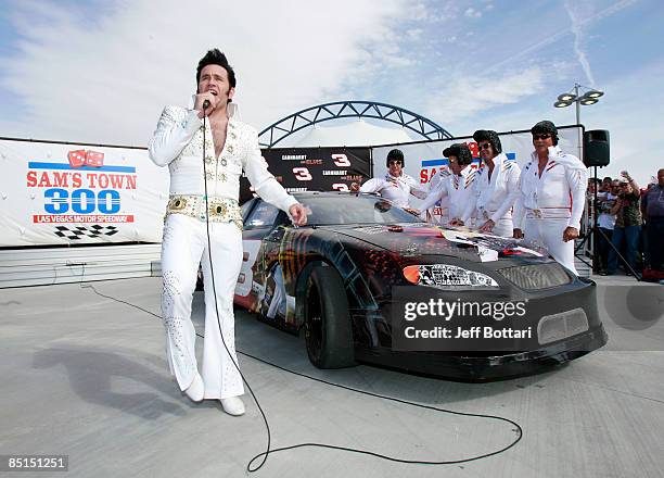 Elvis impersonators pose during practice for the NASCAR Sprint Cup Series Shelby 427 at the Las Vegas Motor Speedway on February 27, 2009 in Las...