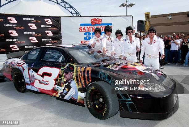 Elvis impersonators pose during practice for the NASCAR Sprint Cup Series Shelby 427 at the Las Vegas Motor Speedway on February 27, 2009 in Las...