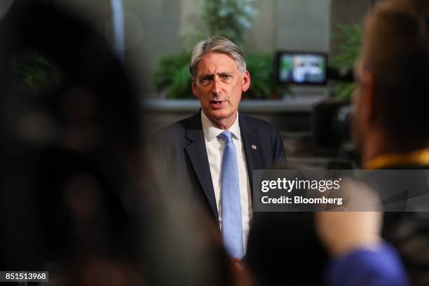 Philip Hammond, U.K. Chancellor of the exchequer, speaks to members of the media following a speech by U.K. Prime Minister Theresa May at Complesso...