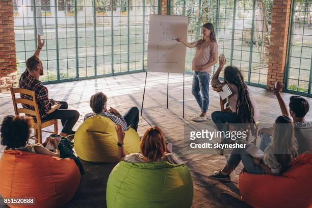 yes colleague, tell us your idea! - training bean bag stock pictures, royalty-free photos & images
