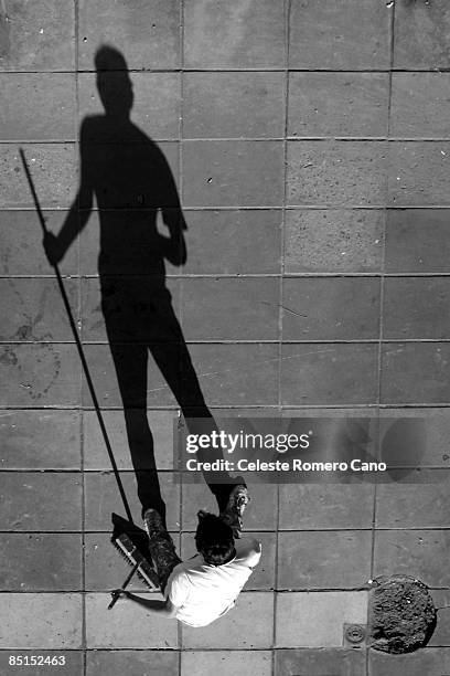 shadow of a garbage, or 'the little prince' - street cleaner stock pictures, royalty-free photos & images