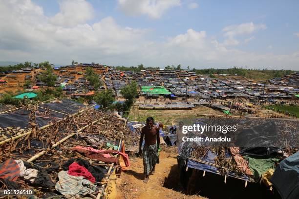 Rohingya Muslims, fled from ongoing military operations in Myanmars Rakhine state, are seen near a tent at a makeshift camp in Teknaff, Bangladesh on...