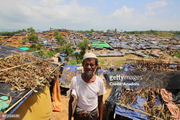 Rohingya Muslim man, fled from ongoing military operations in Myanmars Rakhine state, poses for a photograph near a tent at a makeshift camp in...