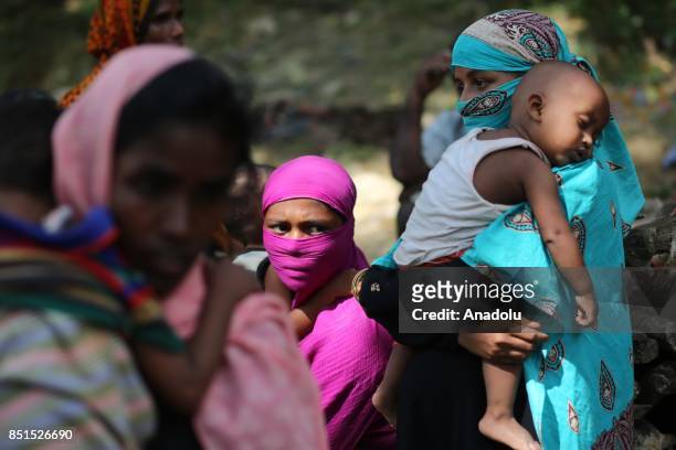 Rohingya Muslim women, fled from ongoing military operations in Myanmars Rakhine state, are seen at a makeshift camp in Teknaff, Bangladesh on...