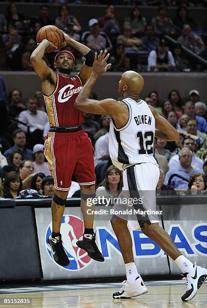 Guard Mo Williams of the Cleveland Cavaliers takes a shot against Bruce Bowen of the San Antonio Spurs on February 27, 2009 at AT&T Center in San...