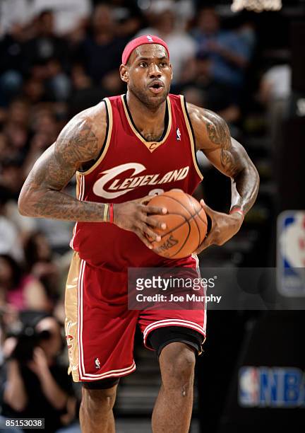 LeBron James of the Cleveland Cavaliers looks to pass against the San Antonio Spurs on February 27, 2009 at the AT&T Center in Houston, Texas. NOTE...