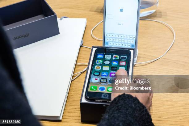 Customer actives their Apple Inc. IPhone 8 smartphone purchase during the sales launch of the Apple Inc. IPhone 8 smartphone, Apple watch series 3...