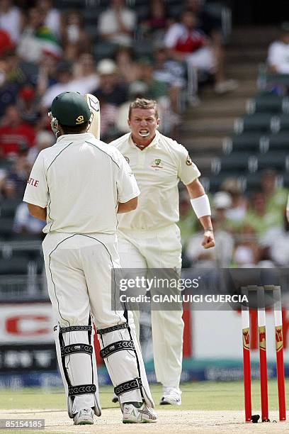 Australian bowler Peter Siddle celebrates on February 28, 2009 after sending South African batsman Neil Mckenzie out during the third day of the...