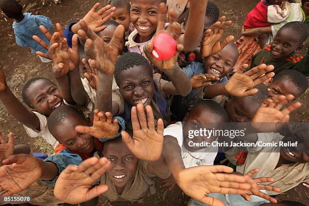 Children pose with a red nose on February 27, 2009 in Moshi Tanzania. Singer Alesha Dixon and Presenter Ben Shephard are in the region for Sunday's...