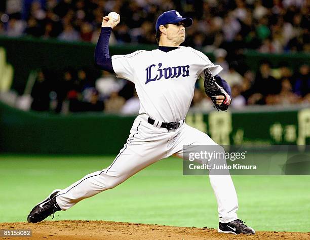 Pitcher John Wasdin of Saitama Seibu Lions throws a pitch during a friendly match between Japan and Saitama Seibu Lions at Tokyo Dome on February 28,...