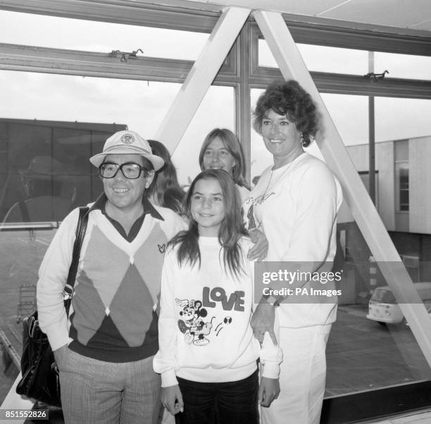 Comedian Ronnie Corbett arriving at Heathrow Airport with his wife Anne and daughters Sophie and Emma, 12. They have returned from a 13-month tour of...