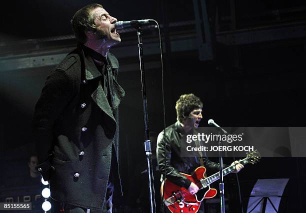 Liam and Noel Gallagher of the band Oasis perform on stage in the southern German city of Munich on February 27, 2009. Oasis are touring around...