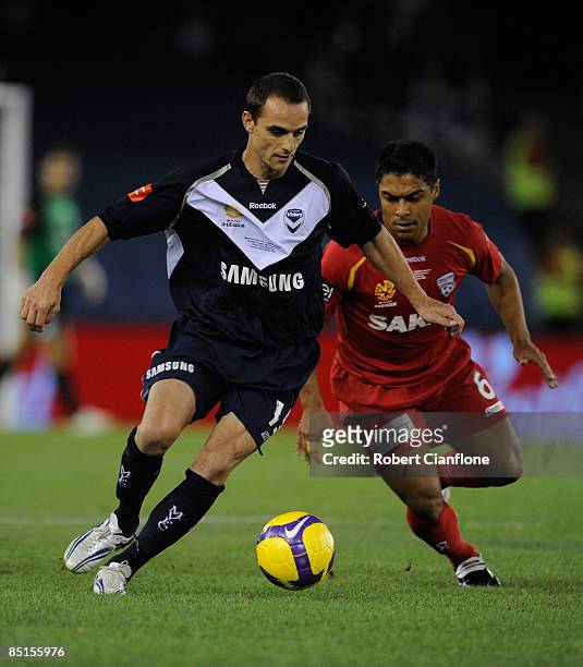 Tomislav Pondeljak of the Victory is shadowed by Cassio Oliveira during the A-League Grand Final match between the Melbourne Victory and Adelaide...