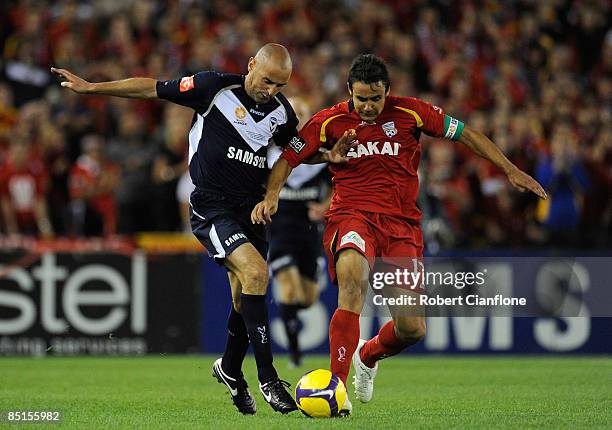 Kevin Muscat of the Victory and Travis Dodd of United compete for the ball during the A-League Grand Final match between the Melbourne Victory and...