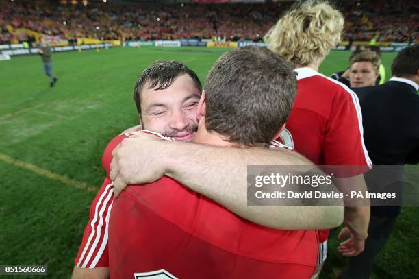 British and Irish Lions' George North and Alex Corbisiero celebrate on the pitch following the game
