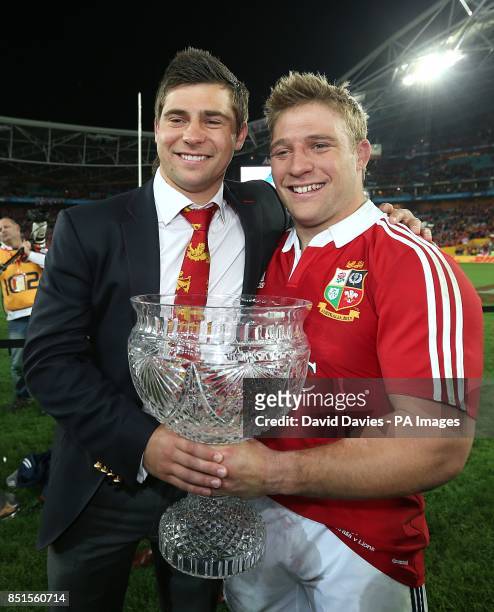 British and Irish Lions' Ben and Tom Youngs celebrate their series victory with the trophy