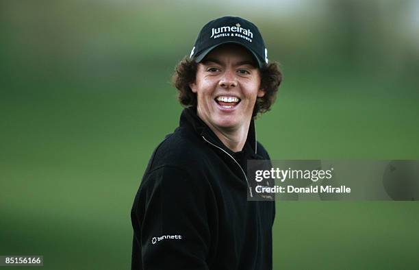 Rory McIlroy of Northern Ireland warms-up on the driving range during the quarter-final round of the Accenture Match Play Championships at the...