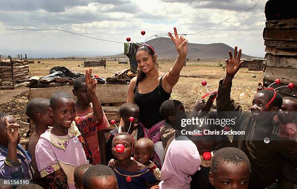 Singer Alesha Dixon meets children in Ngare Naiyobi village with Kilimanjaro District nurse Hossiana Myusa on February 27, 2009 in Moshi Tanzania....