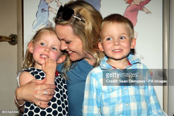 Jo Joyner and twins Edie Fred , aged three-and-a-half attending a special performance show of Were Going On A Bear Hunt at the Lyric Theatre. PRESS...