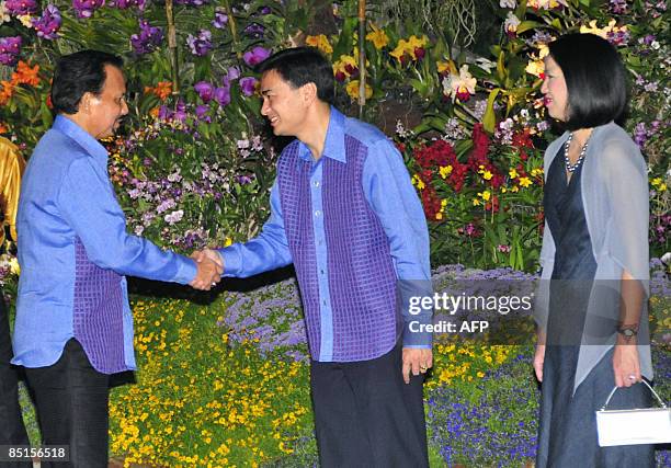 Sultan of Brunei Hassanal Bolkiah is greeted by Thai Prime Minister Abhisit Vejjajiva and his wife Pimpen as he arrives for the gala dinner for ASEAN...