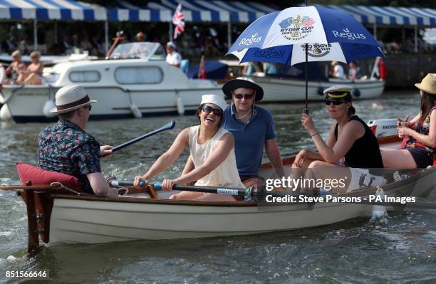 Boats pass by on the river during day four of the Royal Henley Regatta, Henley on Thames.