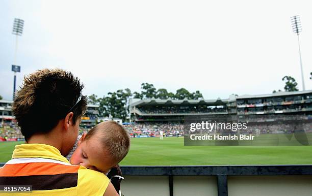 Young fan takes a nap during day three of the First Test between South Africa and Australia played at the Wanderers on February 28, 2009 in...