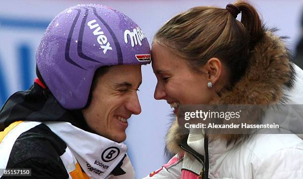 Martin Schmitt of Germany smiles with his girlfriend Patricia after missing the final round of the Large Hil event at FIS Nordic World Ski...