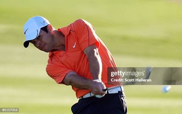 Paul Casey of England hits his approach shot on the second hole during the quarterfinals of the Accenture Match Play Championship at the Ritz-Carlton...