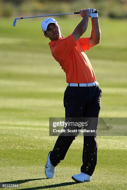 Paul Casey of England hits his approach shot on the second hole during the quarterfinals of the Accenture Match Play Championship at the Ritz-Carlton...