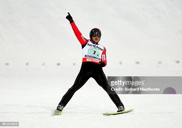 Takanobu Okabe of Japan celebrates as he lands his final jump during the Men's Team Ski Jumping HS134 event at FIS Nordic World Ski Championships on...