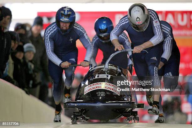 Great Britain 1 piloted by Lee Johnston, takes off from the start of the course during first run of the Bobsled competition during the FIBT Bobsled...