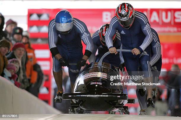 Great Britain 2, piloted by John James Jackson, takes off from the start of the course during first run of the Bobsled competition during the FIBT...