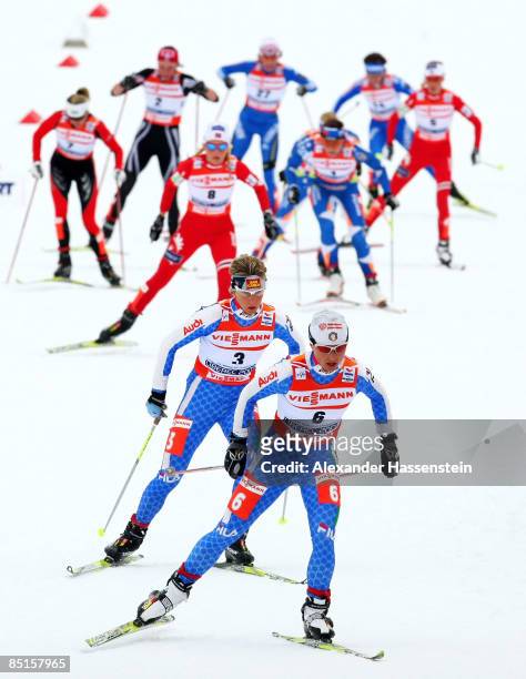 Arianna Follis and Marianna Longa of Italy head the field during the Ladies Cross Country 30KM race at the FIS Nordic World Ski Championships 2009 on...