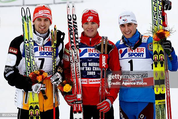 Bjoern Kircheisen of Germany takes 2nd place, Bill Demong of USA takes 1st place, Jason Lamy Chappuis of France Takes 3rd place during the FIS Nordic...