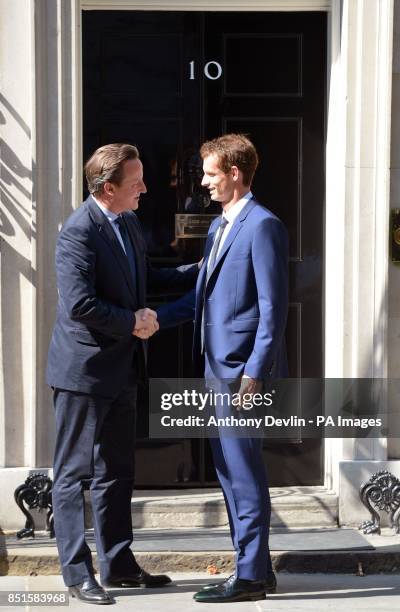 Prime Minister David Cameron greets Wimbledon winner Andy Murray outside 10 Downing Street before attending a cross-party reception in the garden,...