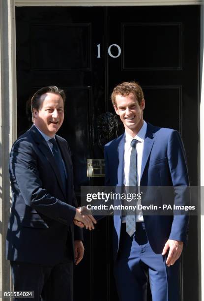 Prime Minister David Cameron greets Wimbledon winner Andy Murray outside 10 Downing Street before attending a cross-party reception in the garden,...