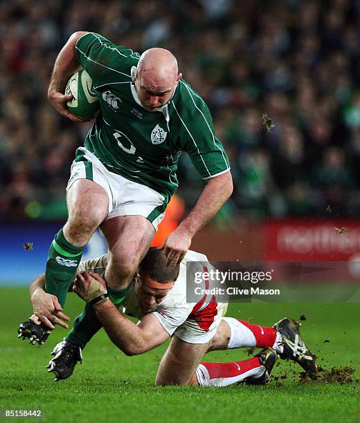 John Hayes of Ireland is tackled by Joe Worsley of England during the RBS Six Nations match between Ireland and England at Croke Park on February 28,...