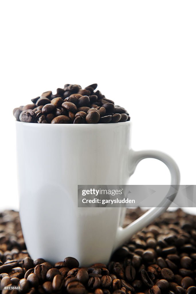 Coffee cups with coffee beans