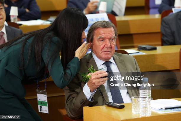 Gerhard Schroeder and So-Yeon Kim are seen during a opening ceremony at the National Assembly on September 11, 2017 in Seoul, South Korea. Schroeder...