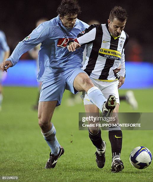 Juventus forward Alex Del Piero is tackled by Napoli's defender Matteo Contini during their Serie A football match at Turin's Olympic Stadium on...