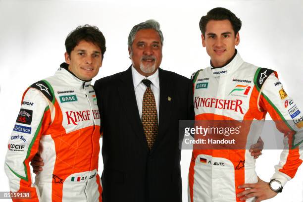 In this handout image supplied by Force India F1, Adrian Sutil of Germany and Force India, Force India F1 Team Owner Dr Vijah Mallya and Giancarlo...