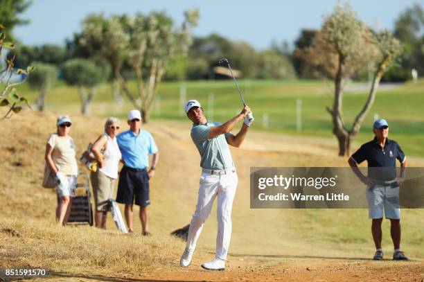 Nino Bertasio of Italy plays his second shot on the 3rd hole during day two of the Portugal Masters at Dom Pedro Victoria Golf Club on September 22,...