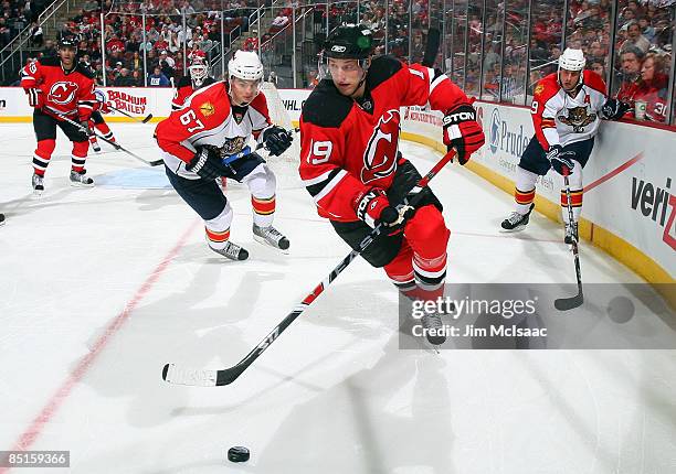 Travis Zajac of the New Jersey Devils skates against the Florida Panthers at the Prudential Center on February 28, 2009 in Newark, New Jersey. The...