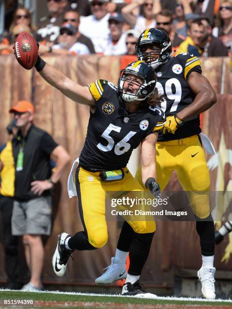 Linebacker Anthony Chickillo and running back Terrell Watson of the Pittsburgh Steelers celebrate after Chickillo recovered a blocked punt for a...