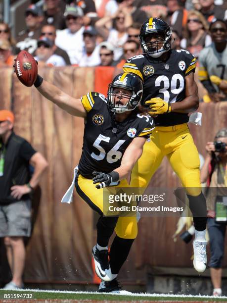 Linebacker Anthony Chickillo and running back Terrell Watson of the Pittsburgh Steelers celebrate after Chickillo recovered a blocked punt for a...